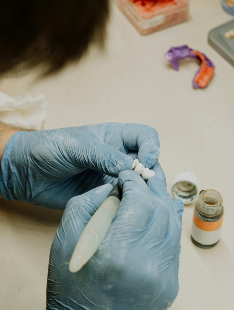 A specialist making dental implants.
