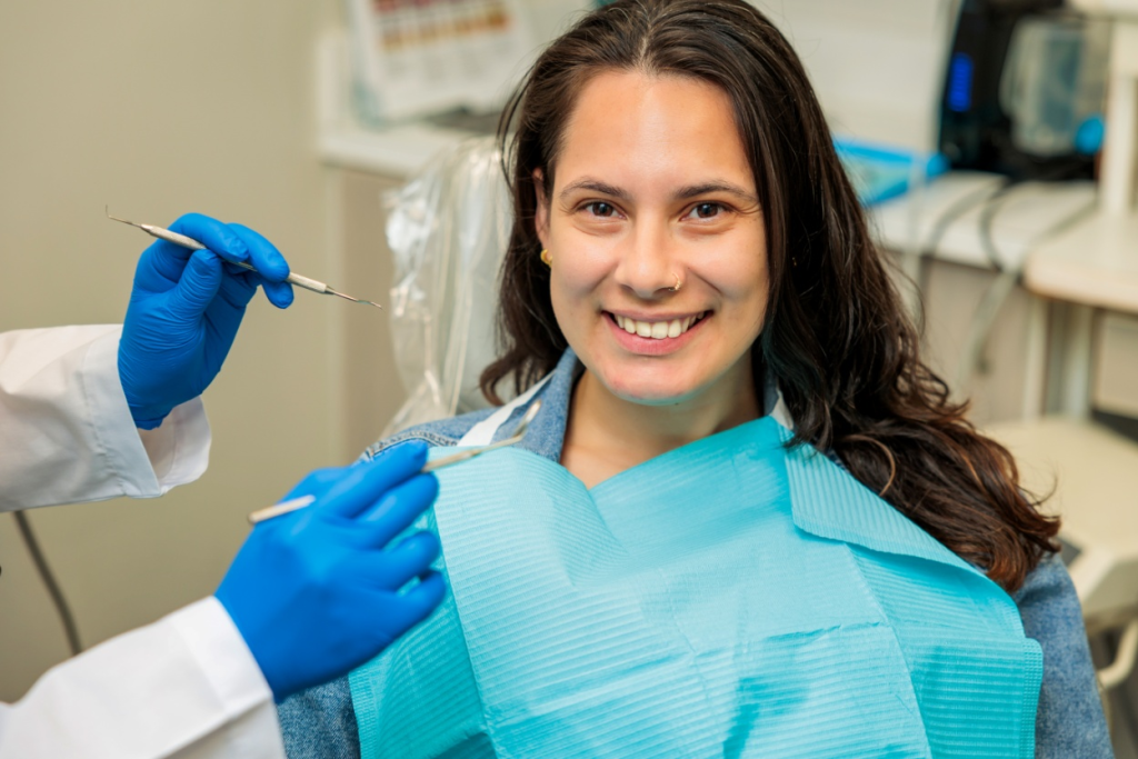 A woman smiling out of satisfaction with her treatment. 